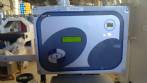 Etiquetadora automtica autoadhesiva para botellas cilndricas