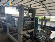Empacadora autom�tica con t�nel de retracci�n para botellas y frascos en fardos.
