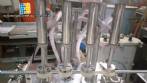 M�quina de llenado lineal de 4 boquillas Erli