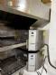 Horno transportador Lincoln de acero inoxidable para hornear galletas y pizza.