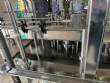Llenadora rotativa gravim�trica de acero inoxidable con cabina