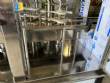 Llenadora rotativa gravim�trica de acero inoxidable con cabina