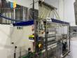 Llenadora gravimtrica y roscadora en sistema lineal de acero inoxidable Robopac IMSB
